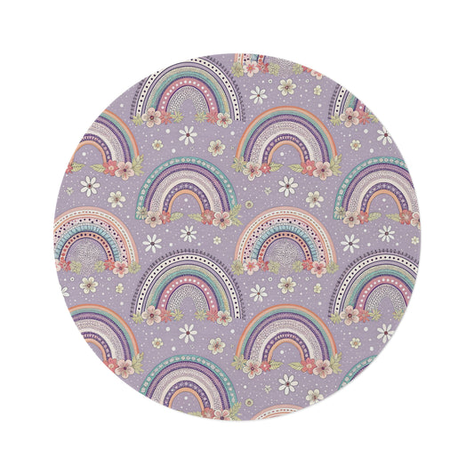Posy Rainbows round nursery rug on a baby room floor