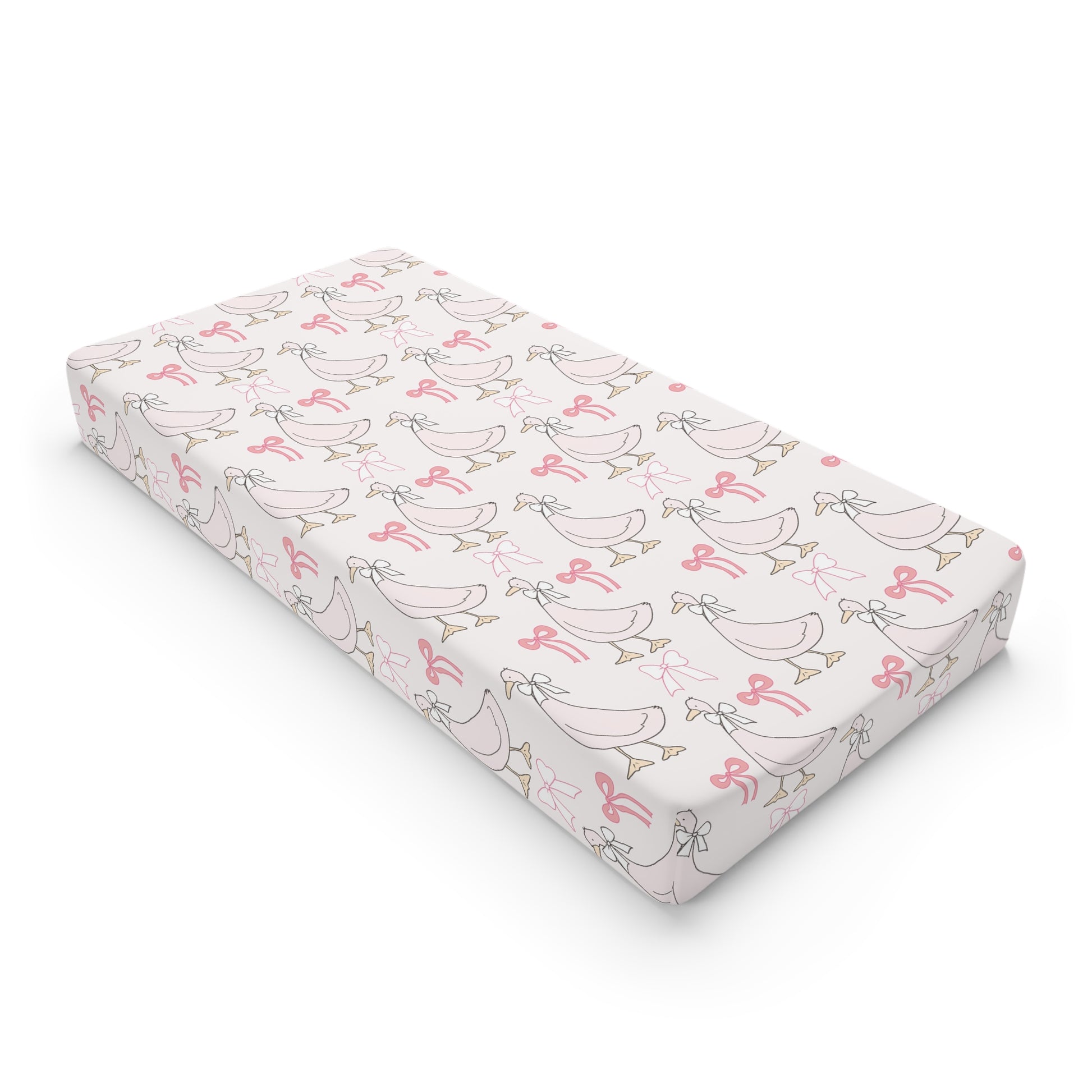 Ribbon Goose changing pad cover on a nursery changing table