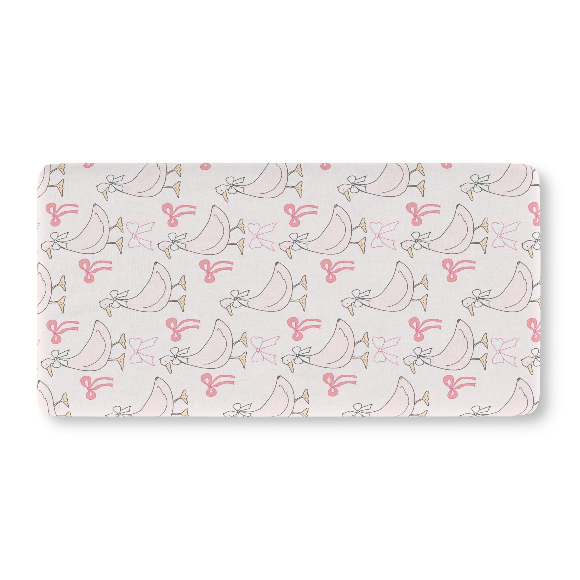 Pink goose crib sheet on a standard crib mattress