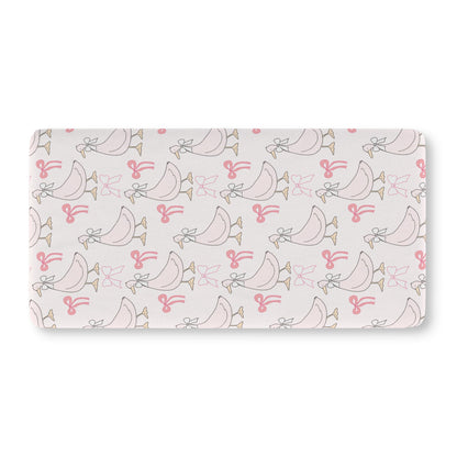 Pink goose crib sheet on a standard crib mattress