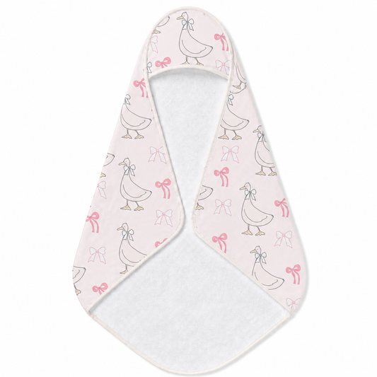 Ribbon Goose hooded baby towel wrapped around a baby