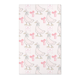 Pink goose and bow nursery area rug on blush