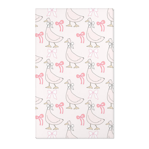 Pink goose and bow nursery area rug on blush