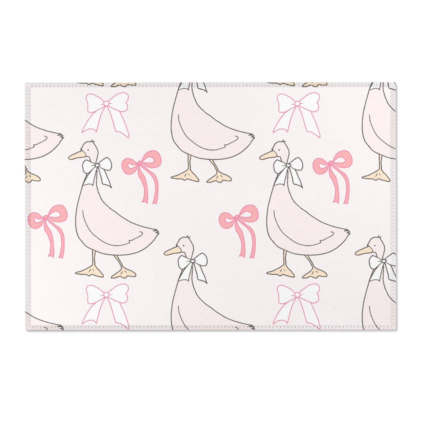 Goose print area rug beside a nursery crib