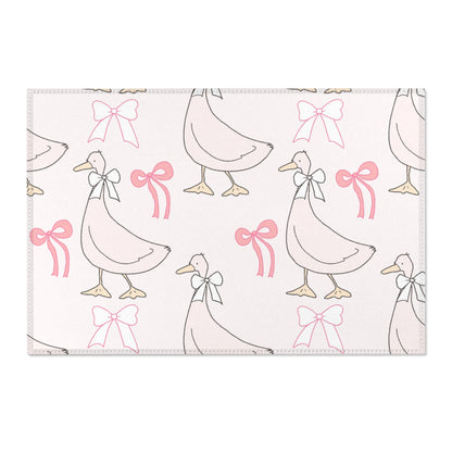 Goose print area rug beside a nursery crib
