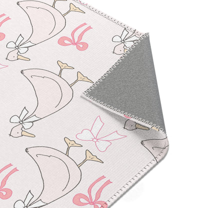 Ribbon Goose rug, geese in bows on a blush ground