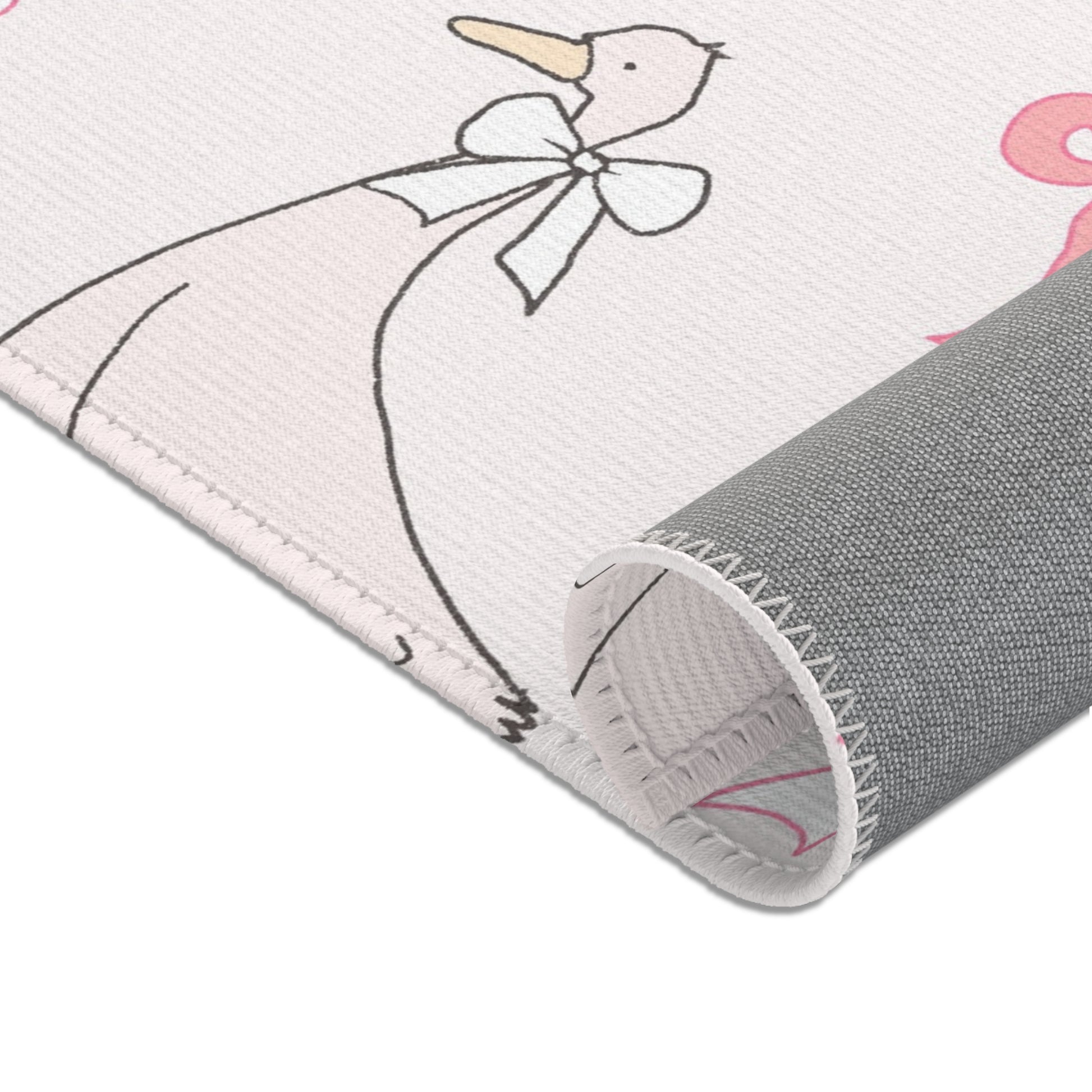 Ribbon Goose nursery area rug in portrait orientation