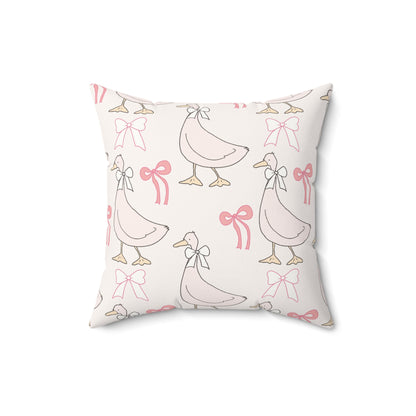 Goose and bow print pillow for a pink nursery