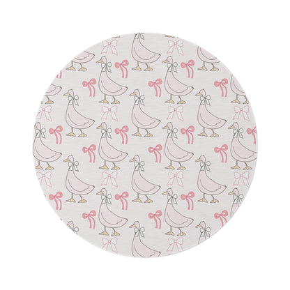 Ribbon Goose round nursery rug on a baby room floor