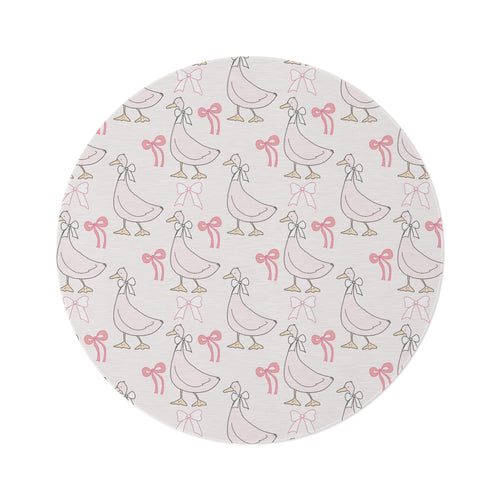 Ribbon Goose round nursery rug on a baby room floor