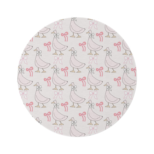 Ribbon Goose round nursery rug on a baby room floor
