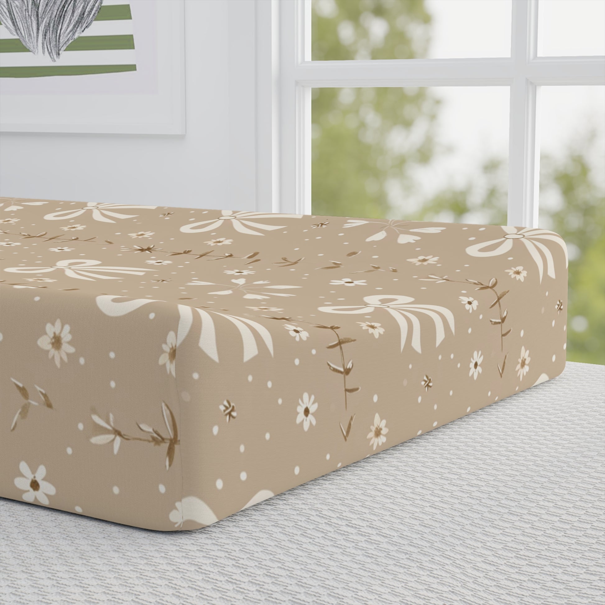 Close detail of the Ribbon Meadow print on the changing pad cover