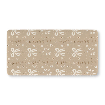 Fitted crib sheet with cream bows and daisies on taupe