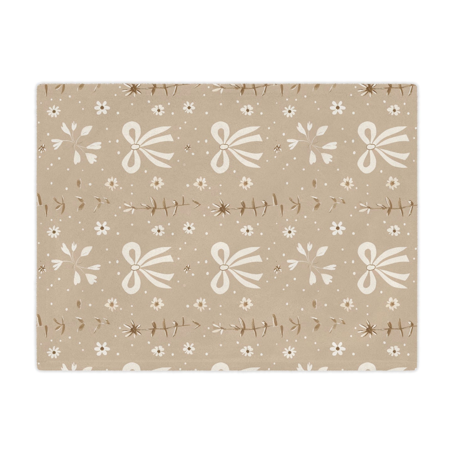 Close detail of the bow and daisy print on the minky blanket