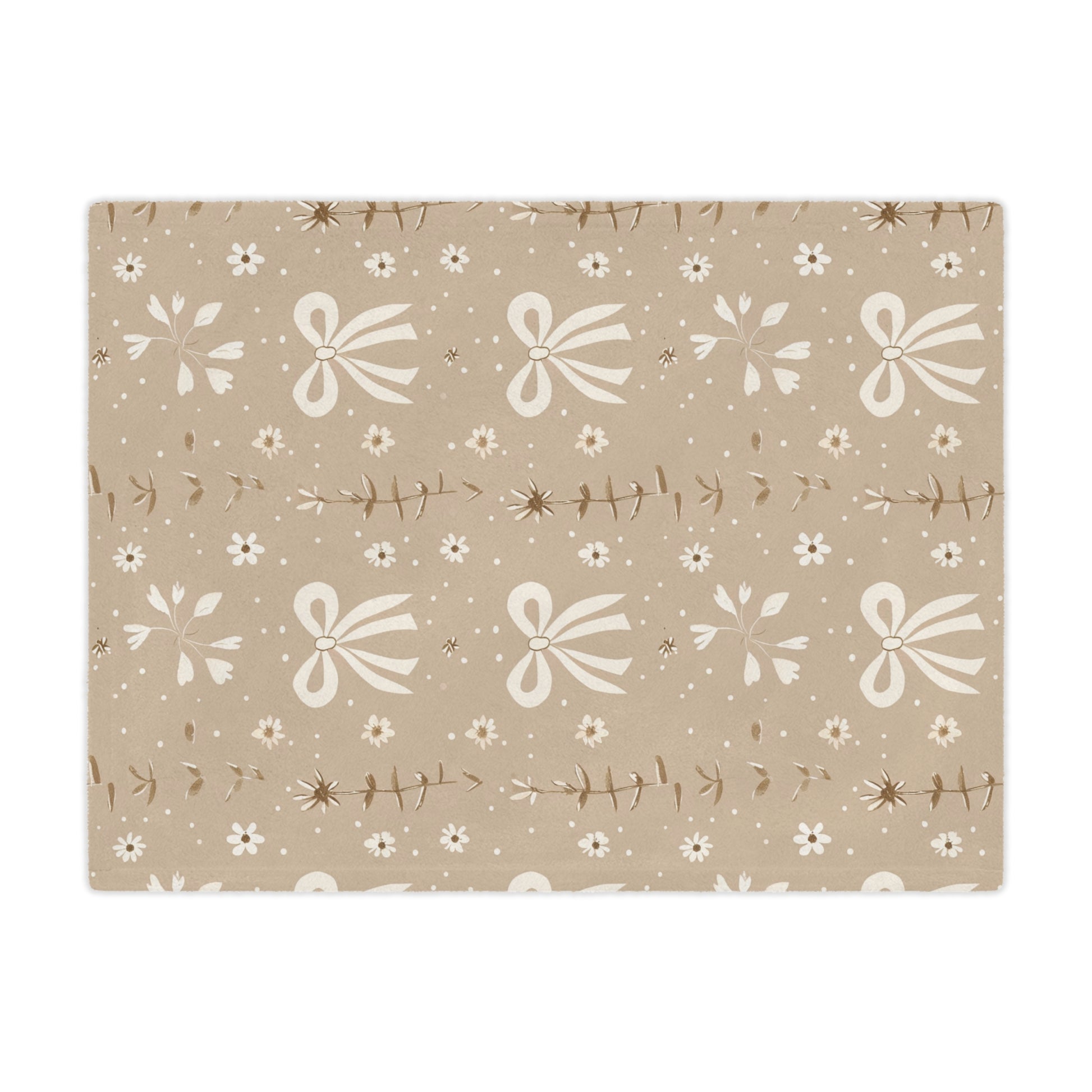Close detail of the bow and daisy print on the minky blanket