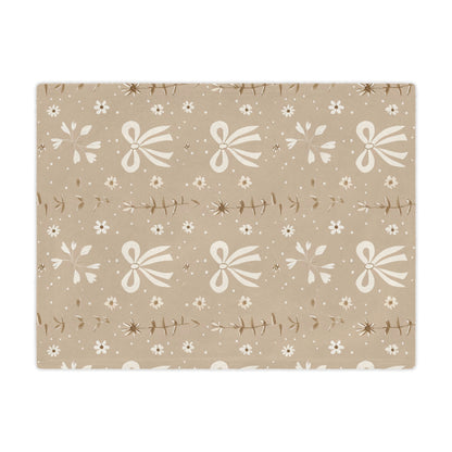 Close detail of the bow and daisy print on the minky blanket