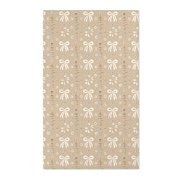 Bow and daisy nursery area rug in cream on soft taupe