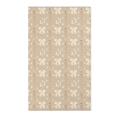 Bow and daisy nursery area rug in cream on soft taupe