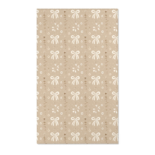 Bow and daisy nursery area rug in cream on soft taupe