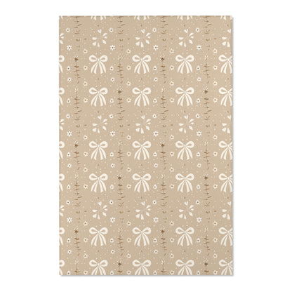 Close detail of the bows and leaf sprigs on the area rug