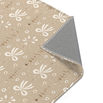 Nursery area rug printed edge to edge with bows and daisies