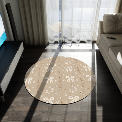 Close detail of the bow motif on the round nursery rug