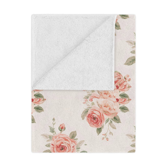 Rose Bouquet minky baby blanket draped over a crib