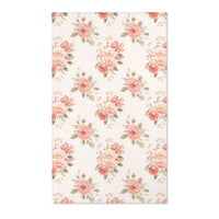 Blush floral nursery area rug with rose bouquets on off-white