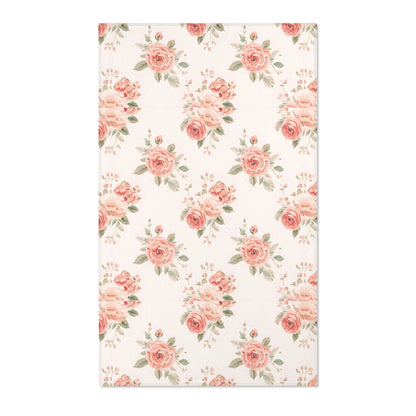 Blush floral nursery area rug with rose bouquets on off-white