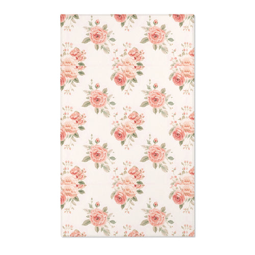 Blush floral nursery area rug with rose bouquets on off-white