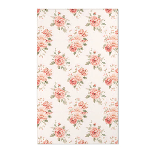 Blush floral nursery area rug with rose bouquets on off-white