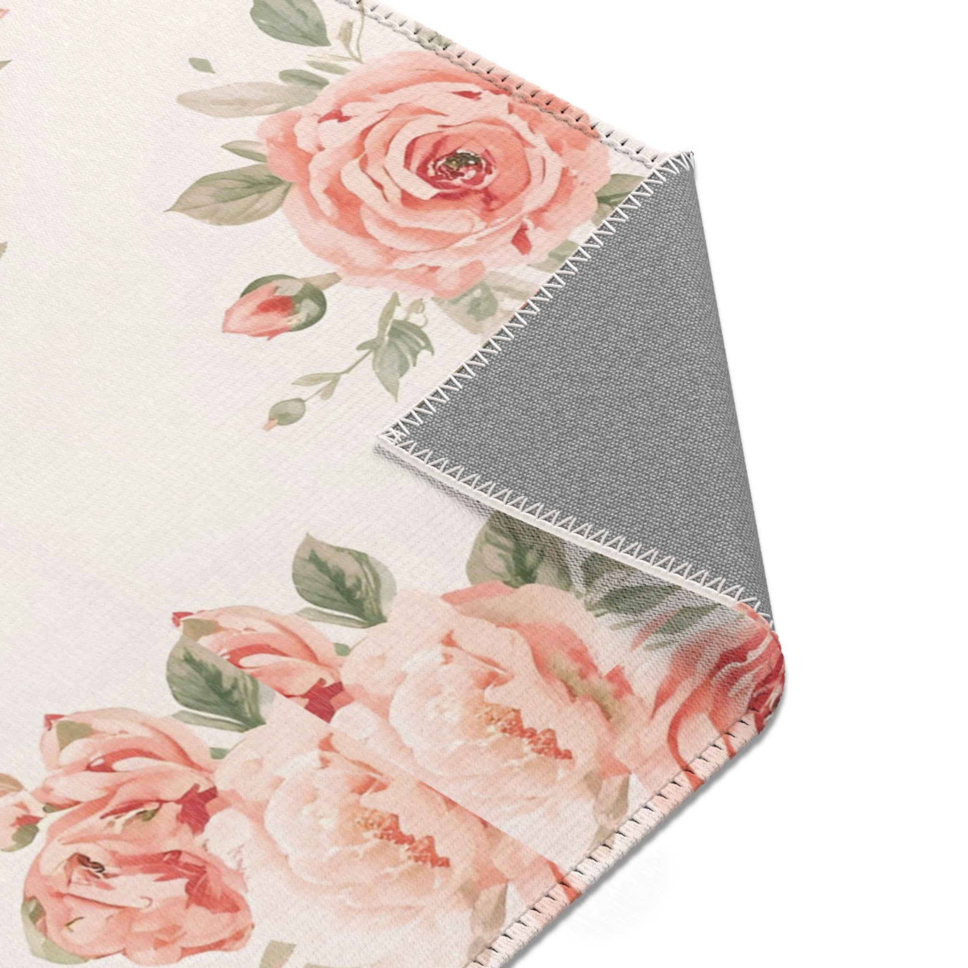 Blush rose rug on off-white for a nursery floor