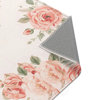 Blush rose rug on off-white for a nursery floor