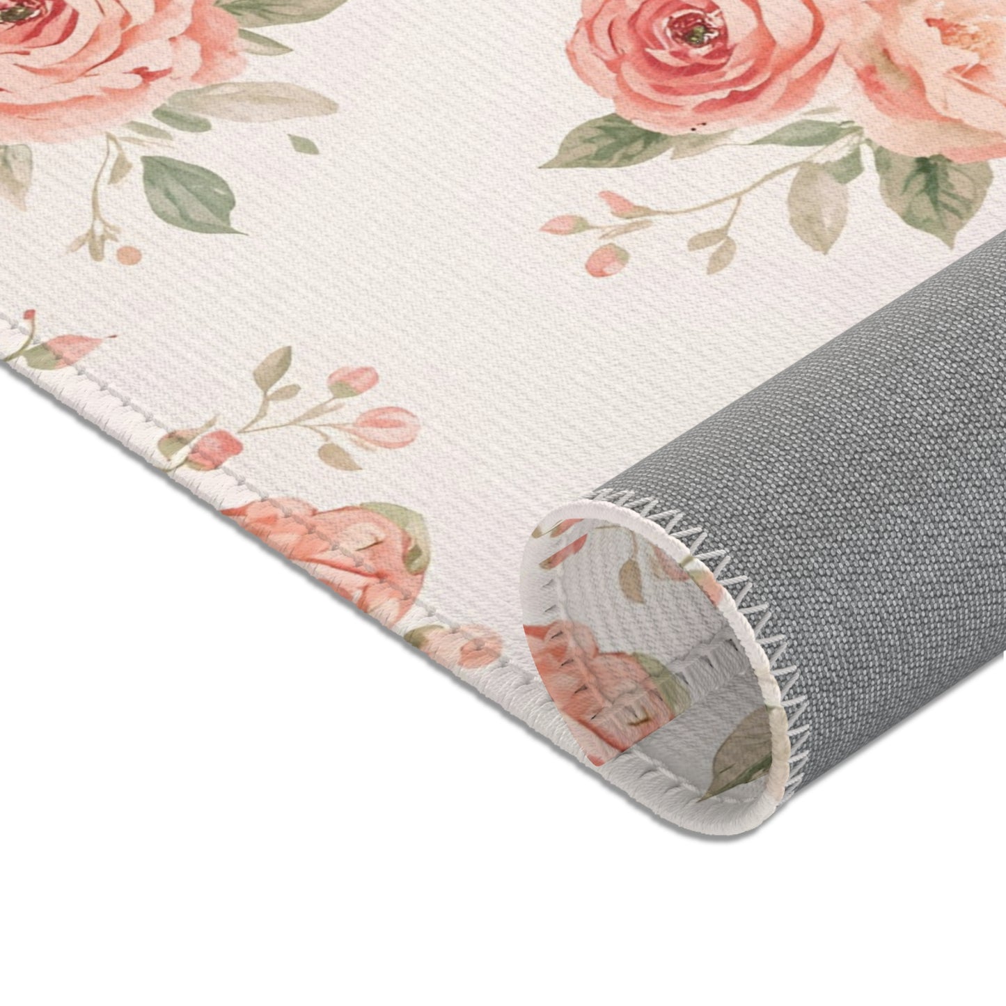 Rose posies and sage leaves across the nursery area rug