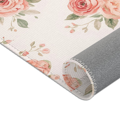 Rose posies and sage leaves across the nursery area rug