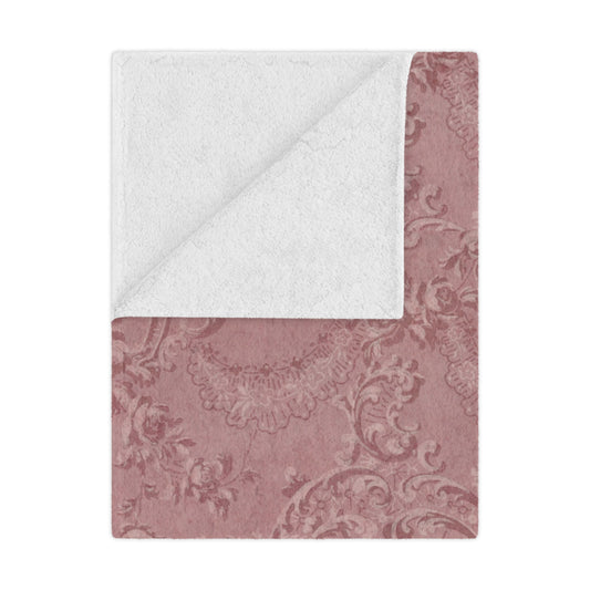 Rose Damask minky baby blanket draped over a crib