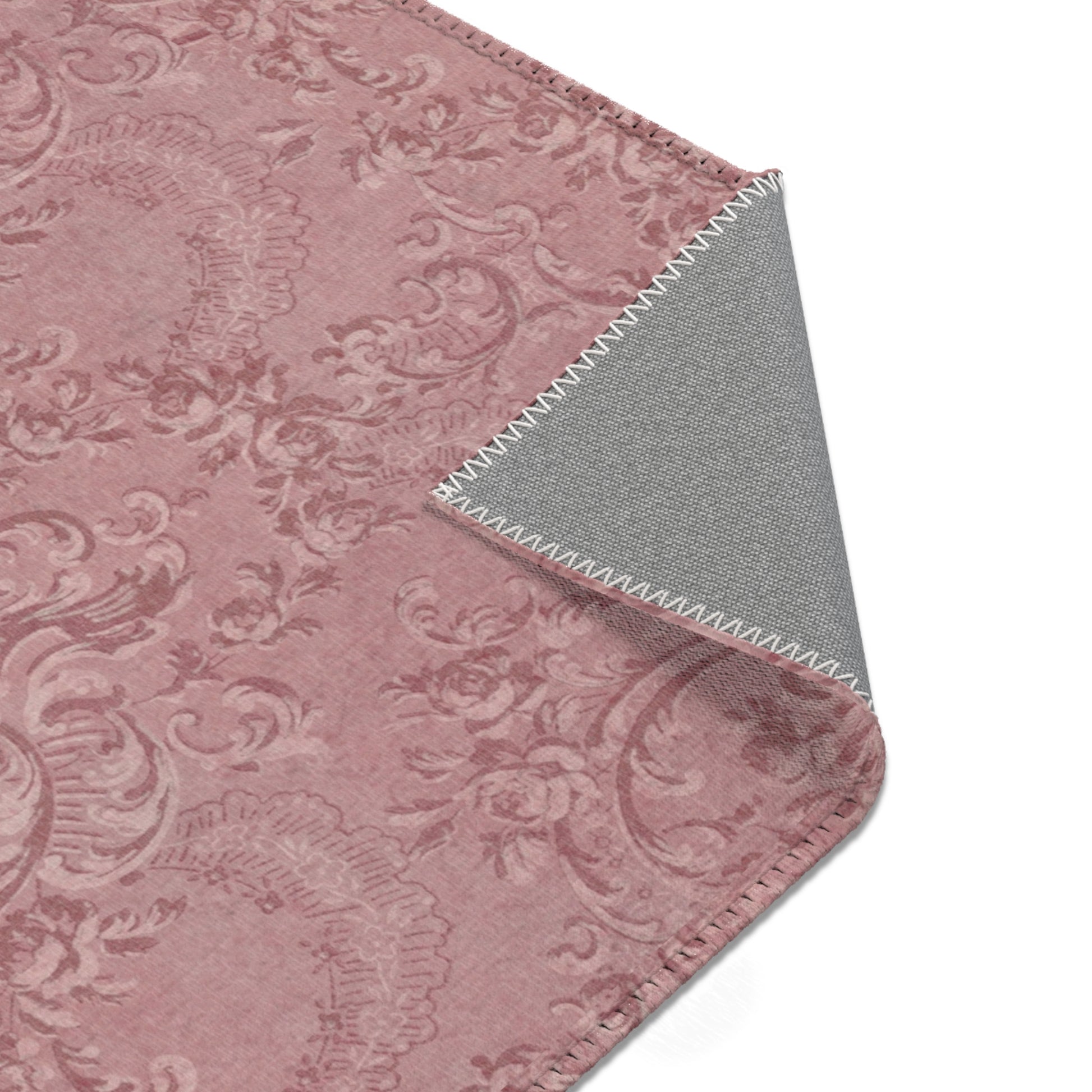Nursery area rug printed edge to edge with damask scrollwork