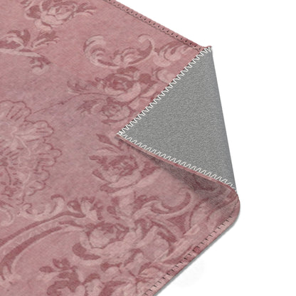 Damask rug in dusty rose for a nursery floor