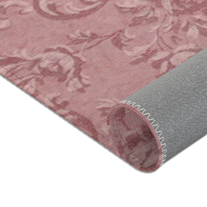 Nursery area rug in a tonal dusty rose palette