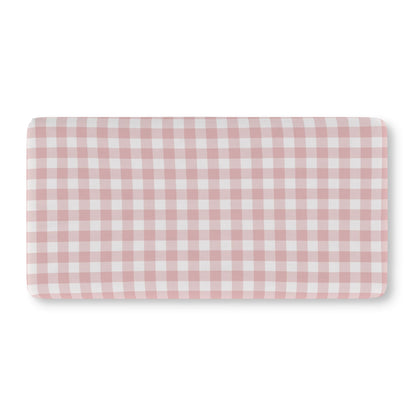 Vintage pink gingham crib sheet on a standard crib mattress