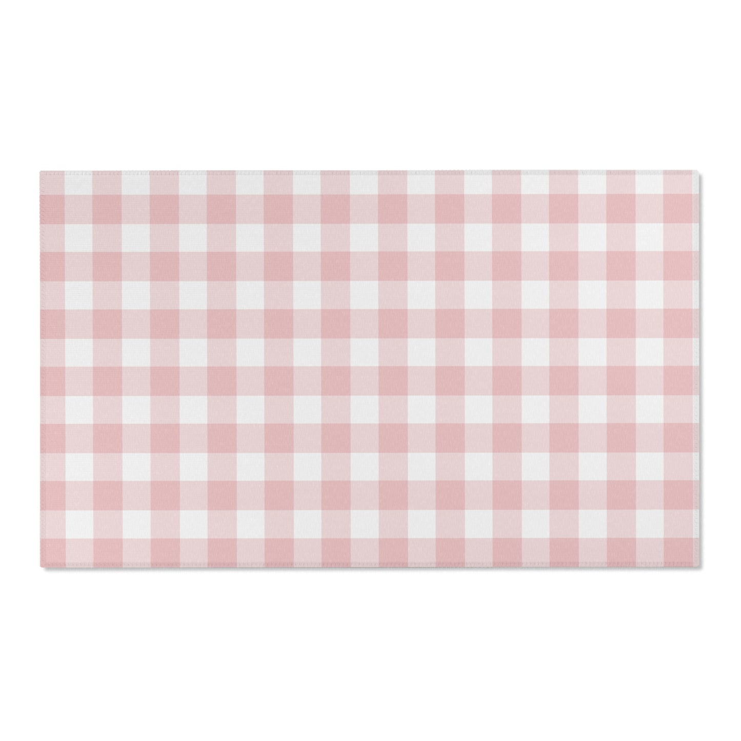 Rose Gingham area rug on a light wood floor