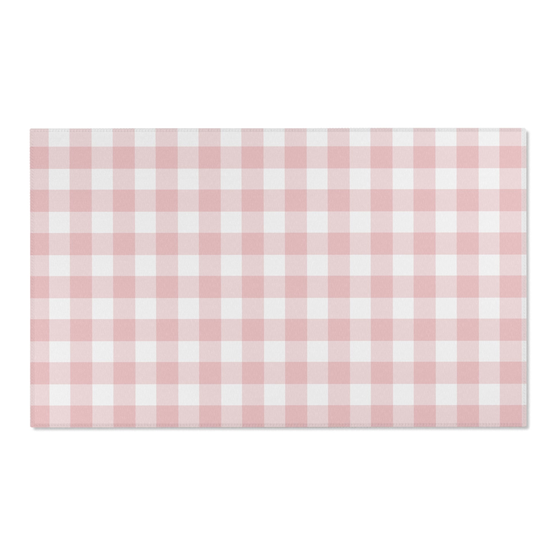 Rose Gingham area rug on a light wood floor