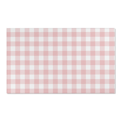Rose Gingham area rug on a light wood floor