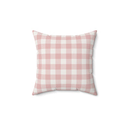 Rose Gingham decorative nursery pillow on a glider chair