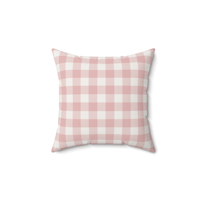 Rose Gingham decorative nursery pillow on a glider chair