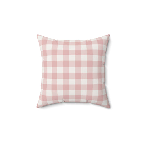 Rose Gingham decorative nursery pillow on a glider chair