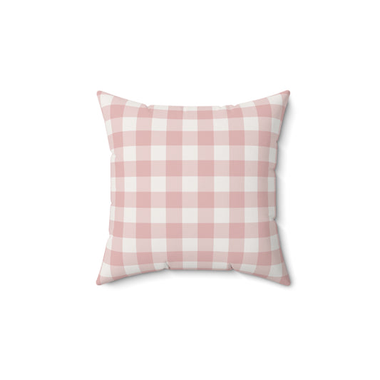 Rose Gingham decorative nursery pillow on a glider chair