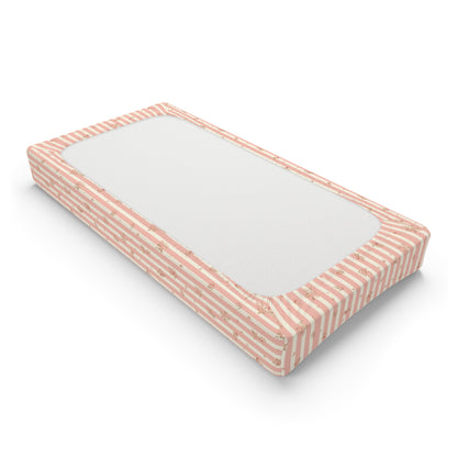 Changing pad cover with pink and cream stripes and roses