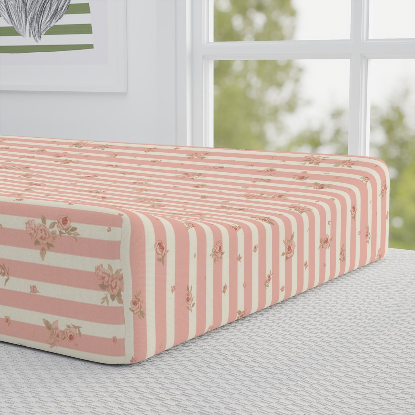 Close detail of the Rose Stripe print on the changing pad cover