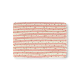 Rose Stripe fitted crib sheet on a nursery crib mattress